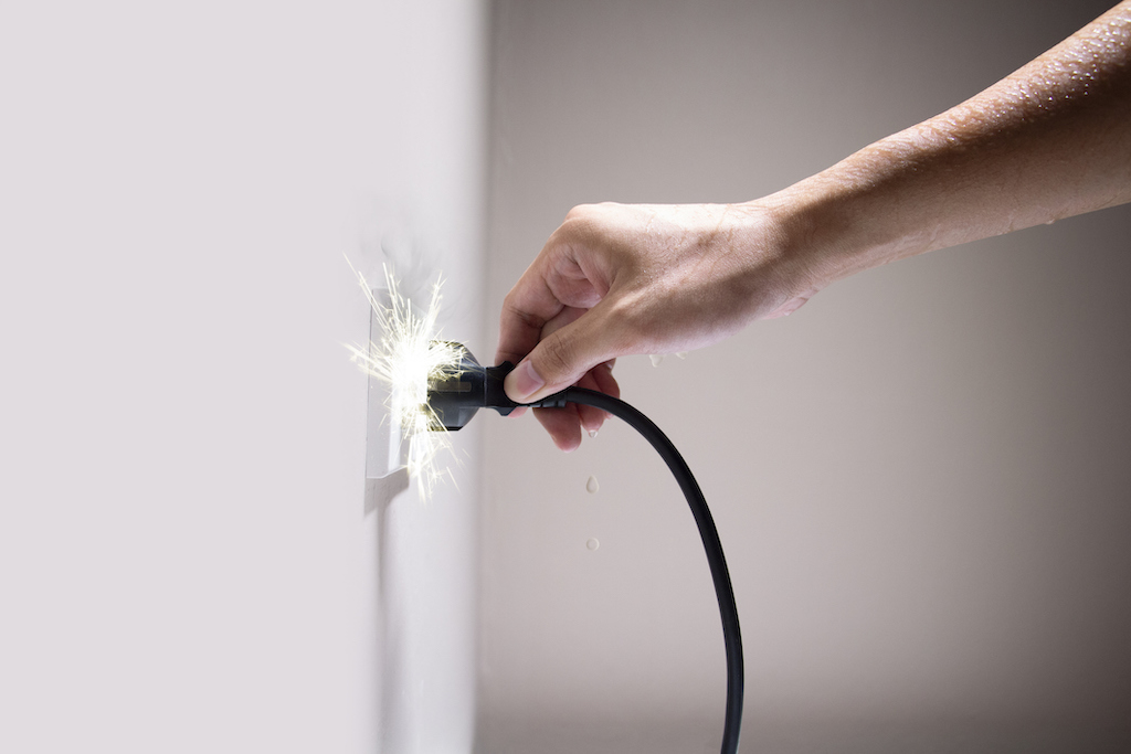 Electrical shock as person plugs in a cord. In need of an emergency electrician.