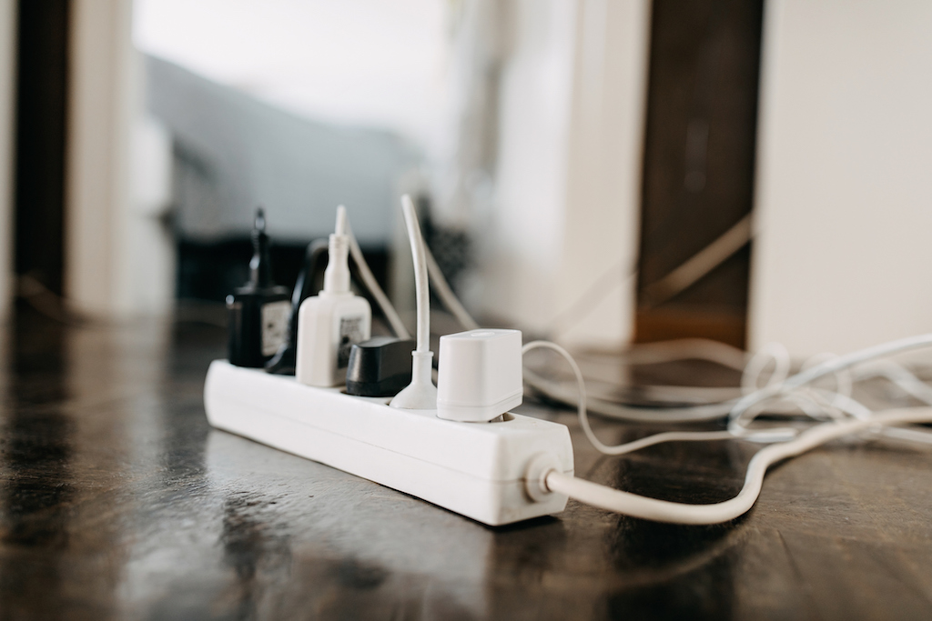 chargers and cords plugged into outlets. emergency electrical service