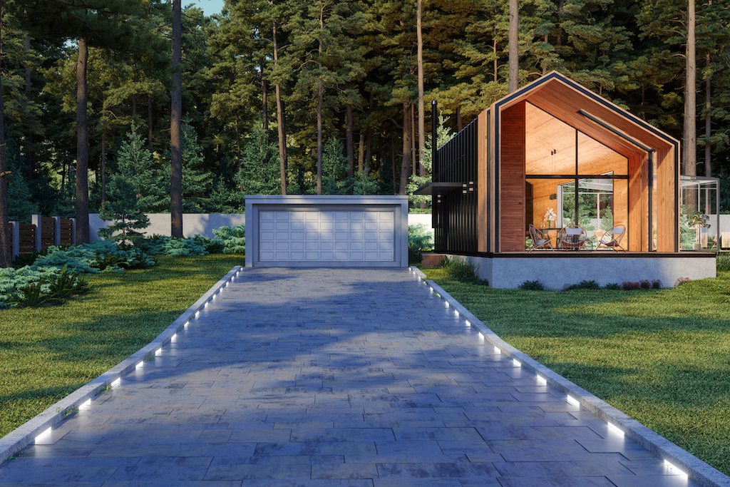 Driveway lighting up the path of a home.